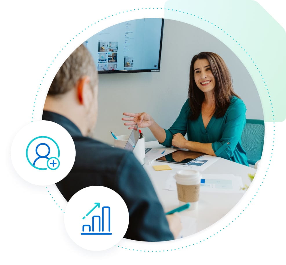 Woman in blue happily speaking to client