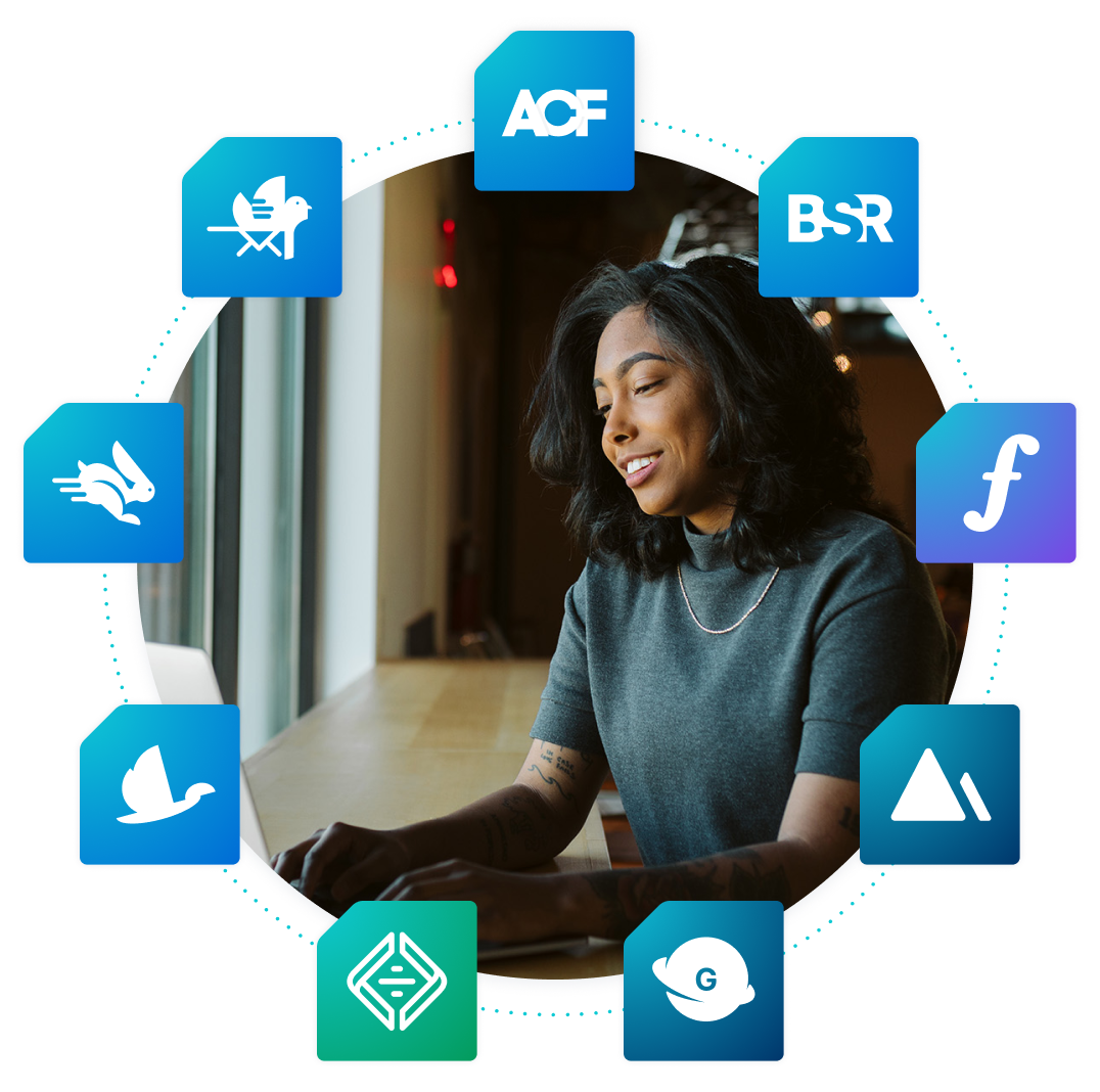 Woman working at a laptop computer with WP Engine tool logos surrounding her.