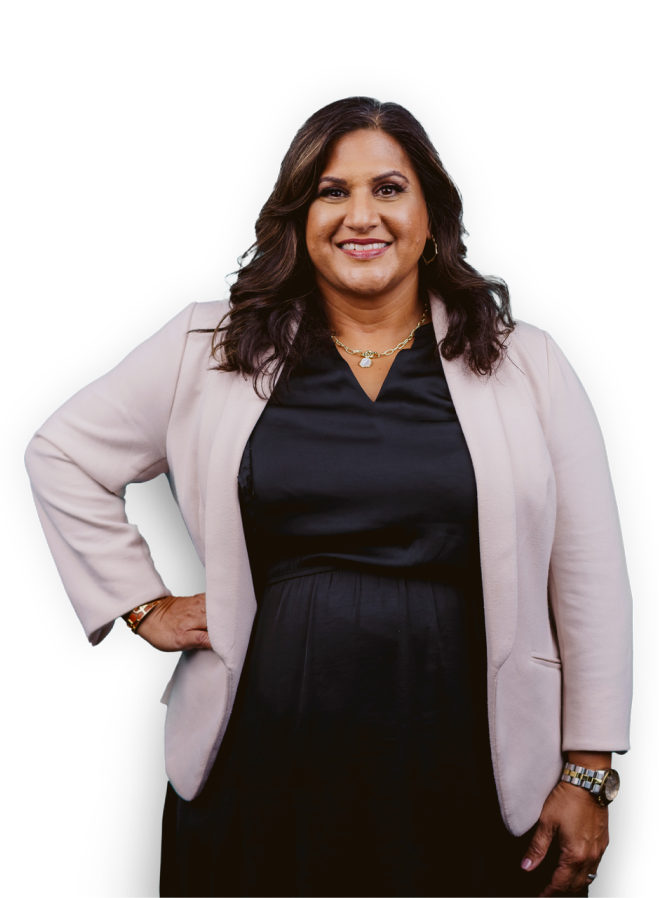 Professional woman in a blazer facing forward and smiling