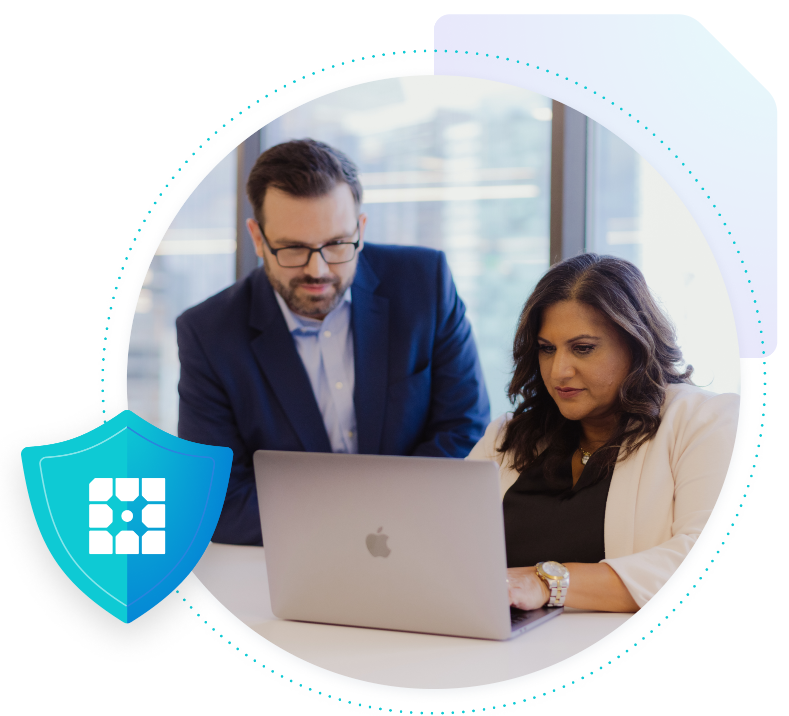 Serious man and woman looking at a laptop with a shield with WP Engine logo overlapping.